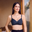 Model wearing a everyday peach lace bra and high-waist brief set in a warm lifestyle shoot for Kurvz